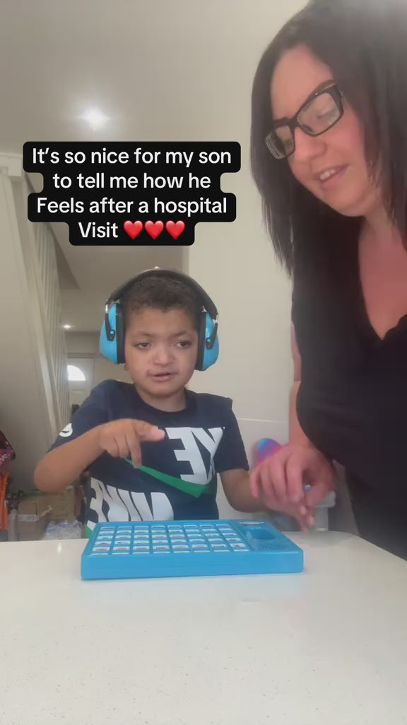 Child using the AAC device at a table